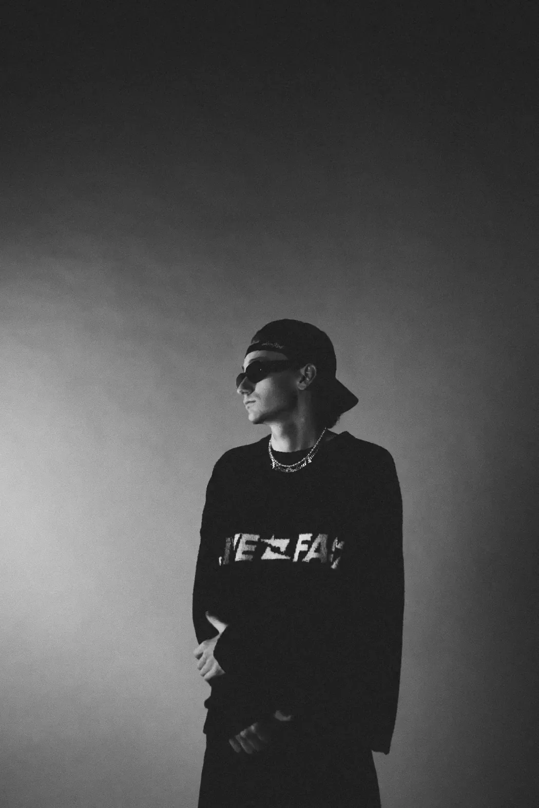 Black and white portrait of C-MON