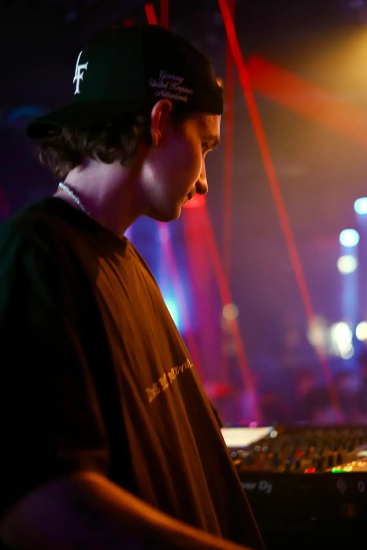 C-MON behind lights at a club